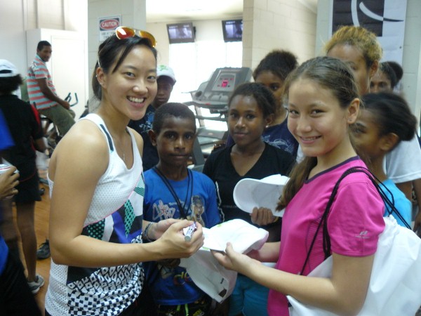 Low Wee Wern Signs Autographs for Young PNG Fans